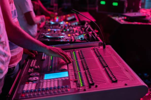 Sound engineer mixed live music concert at a stage performance Sound engineer mixed live music concert at a stage performance radio dj stock pictures, royalty-free photos & images