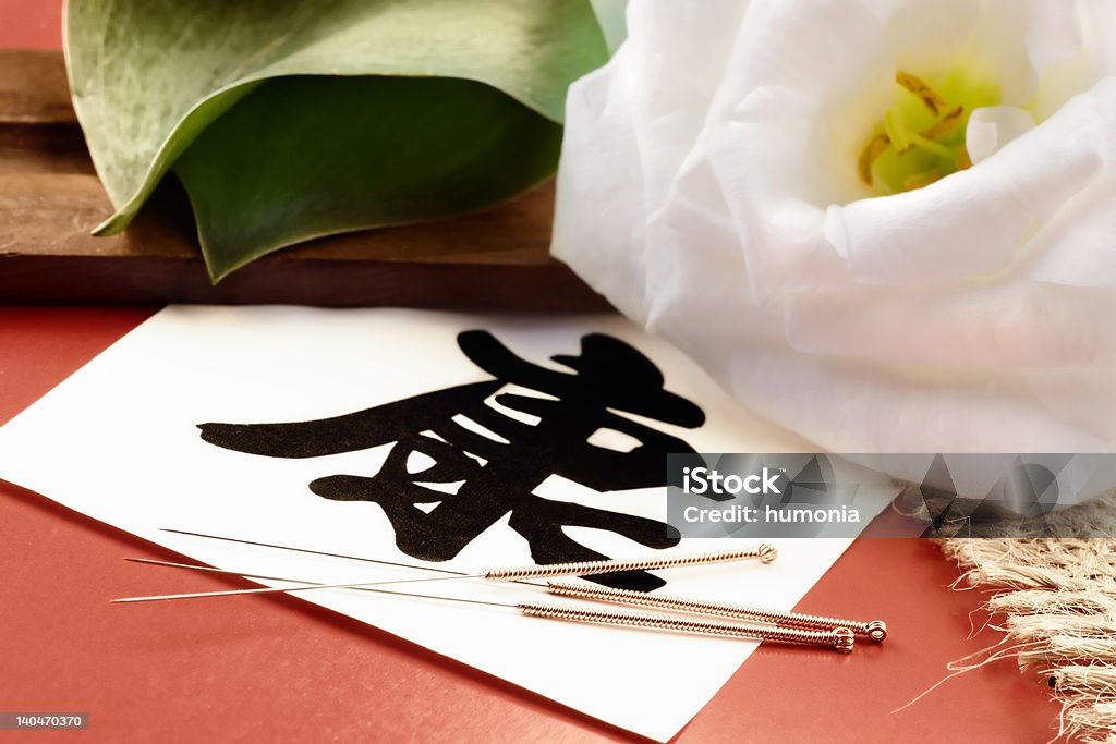 Chinese Medicine Chinese medicine concept. Acupuncture needles and a sign of health. Acupuncture Stock Photo
