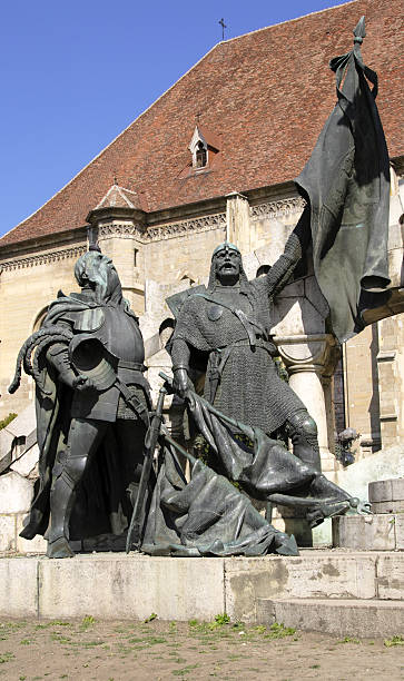 istock two warrior statues in which they are celebrating victory 140470393