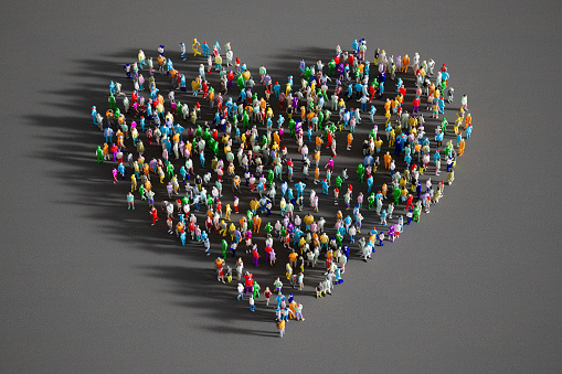 High angle view of 3d people gathered forming a heart shape.