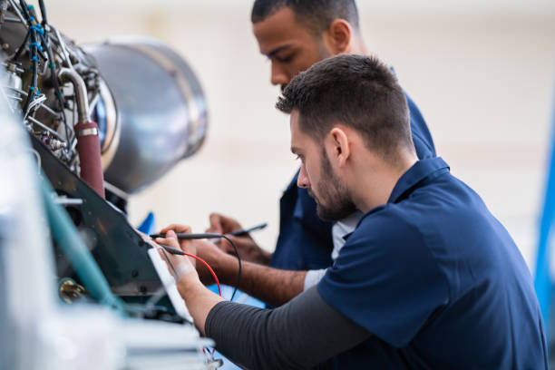 istock Two Aircraft Mechanics In The Hangar 1404705779