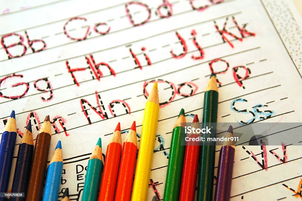 Learning ABC's Colored pencils used to trace ABC's in learning tablet. Alphabet Stock Photo