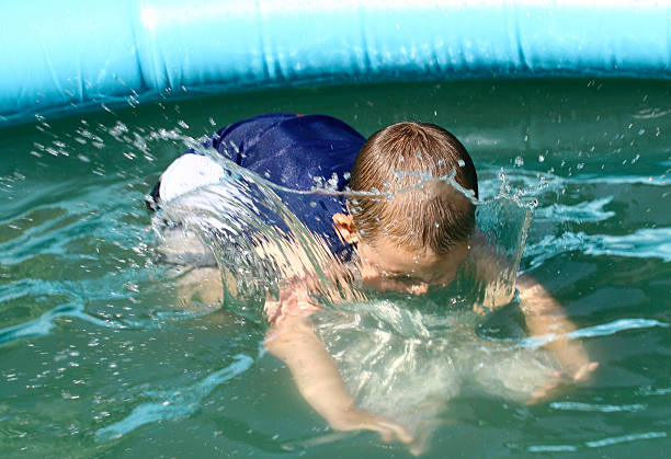 Boy to dip in water stock photo