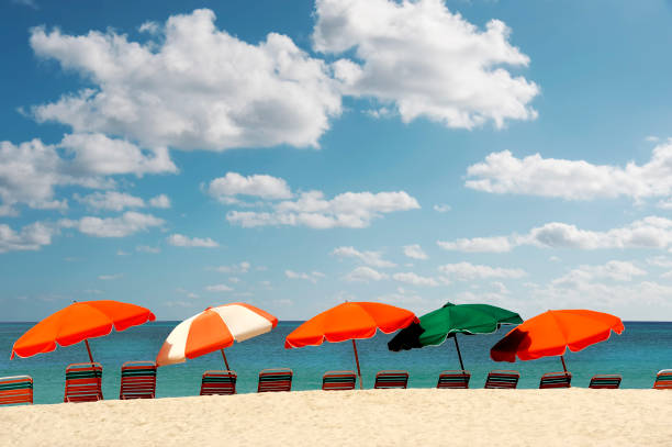 istock colorful beach umbrellas on sandy beach 1404711619
