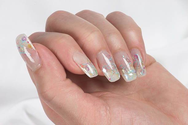 istock Female hand showing off long nails and nail art 140471251