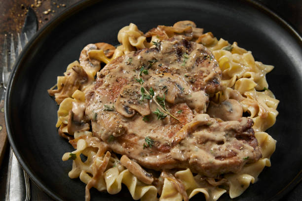 istock Braised Pork Chops in Creamy Mushroom Sauce 1404712692