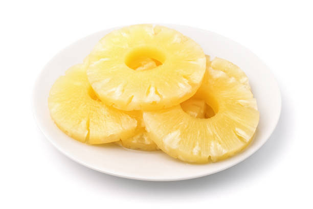 istock Canned pineapple slices on plate 1404712841