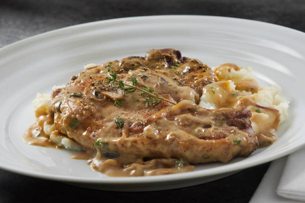 istock Braised Pork Chops in Creamy Mushroom Sauce 1404712889