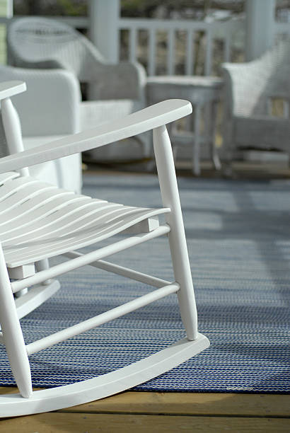 A cottage porch with decking and seats stock photo