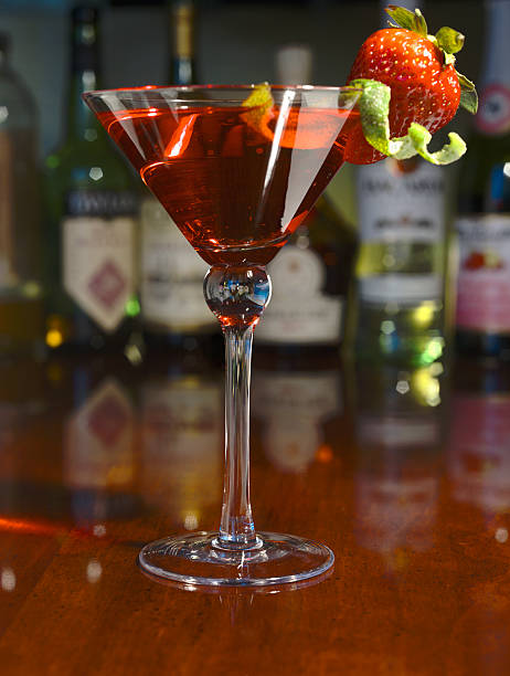 istock Red martini with strawberry and lime peel  on a bar 140471425