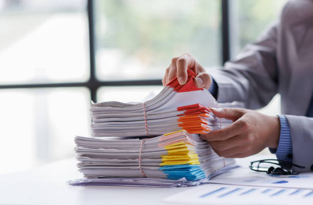 istock Business Documents, Auditor businesswoman checking searching document legal prepare paperwork or report for analysis TAX time,accountant Documents data contract partner deal in workplace office 1404714830