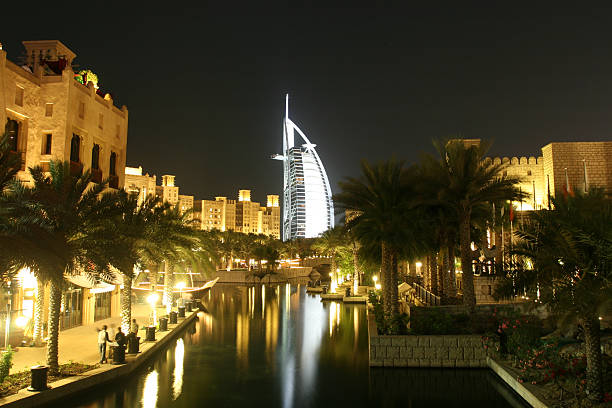 Dubai, United Arab Emirates - March 3, 2024: Burj Al Arab building at night seen from Palm Jumeirah island in Dubai