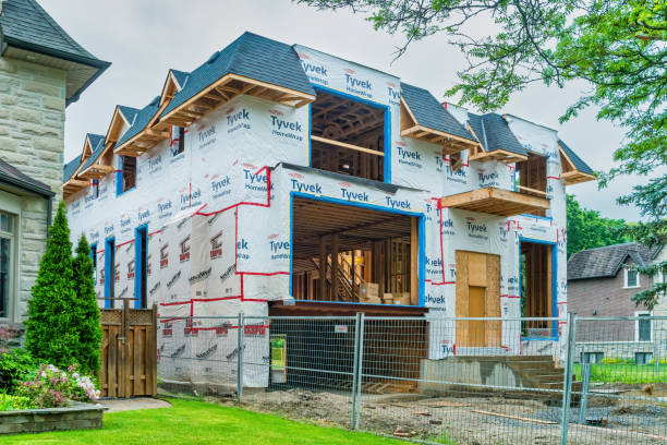 Large luxury house is under construction in Toronto, Ontario, Canada on a cloudy day.