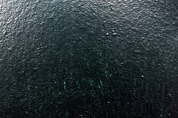 Painted gray speckled wall with pebbles