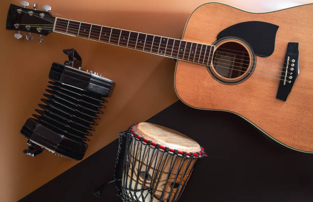 istock Flat lay, music background with acoustic guitar and drum. 1404719782