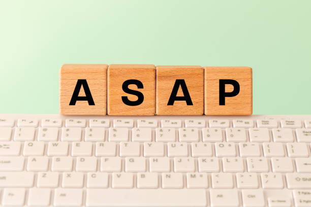 istock The word ASAP As soon as possible, Internet abbreviation used in communication, e.g. in business, The inscription on wooden blocks against the background of a computer keyboard 1404720959