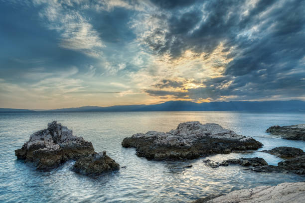 Beautiful sunset above the sea with nice sky with clouds
