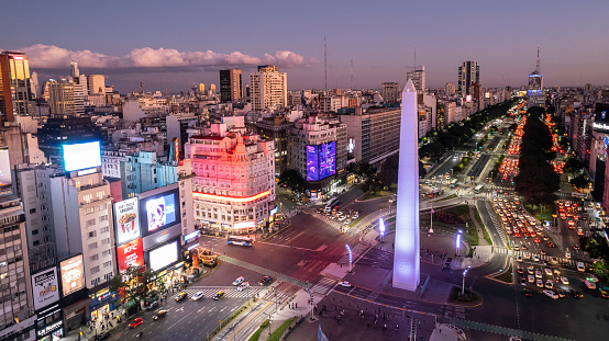 Traffic on a sunset at the obelisk and Avenida 9 de Julio in Buenos Aires - Argentina