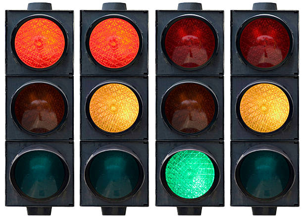 istock Traffic lights lined up, red yellow and green lit 140472351