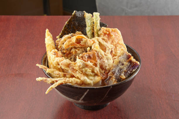 istock deep fried Soft Shell Crab Tendon served in a dish isolated on wooden table background side view of singapore food 1404723598