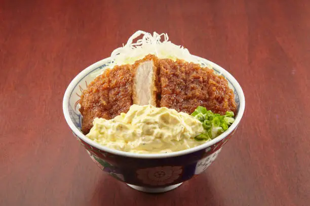 Tar Tar Katsu Don served in a dish isolated on wooden table background side view of singapore food