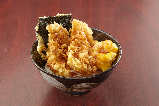 White fish Tendon served in a dish isolated on wooden table background side view of singapore food
