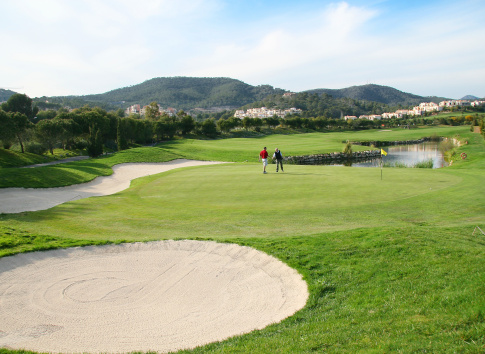 Wide angle grass golf course on a sunny day