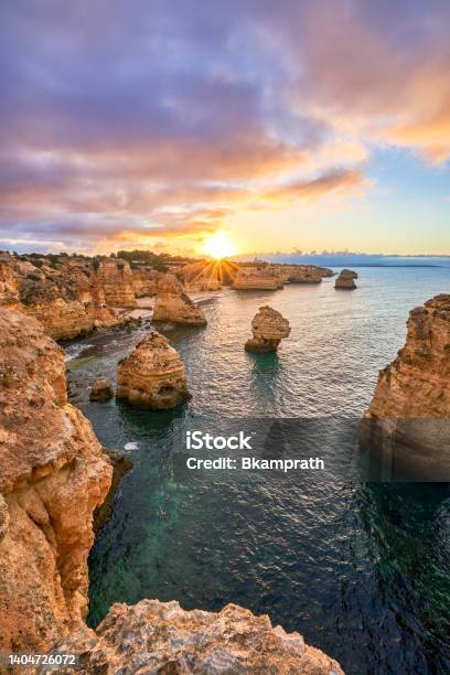 Sunrise At Praia Da Marinhas Rocky Cliffs Along The Famous Algarve Coast In Southern Portugal Europe Stock Photo - Download Image Now