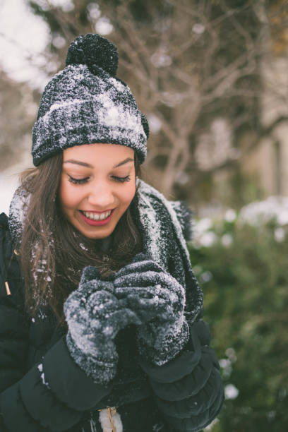 istock young woman enjoys cold winter day 1404726595