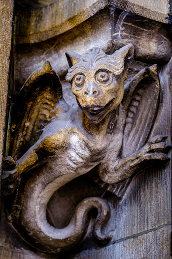 Seville, Spain - January 15, 2024: Close-up of a stone gargoyle part of the exterior architecture in the Seville Cathedral