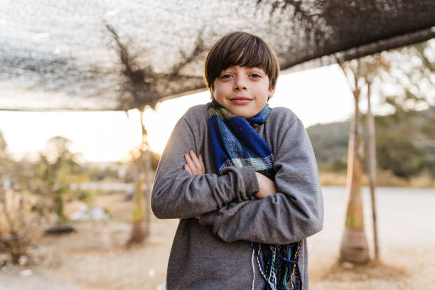 istock Boy bundled up on the farm 1404727414