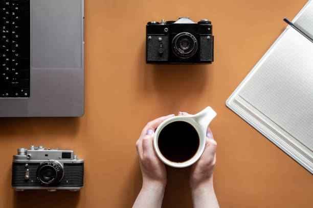 istock Vintage retro cameras on colored background, flat lay. 1404727905