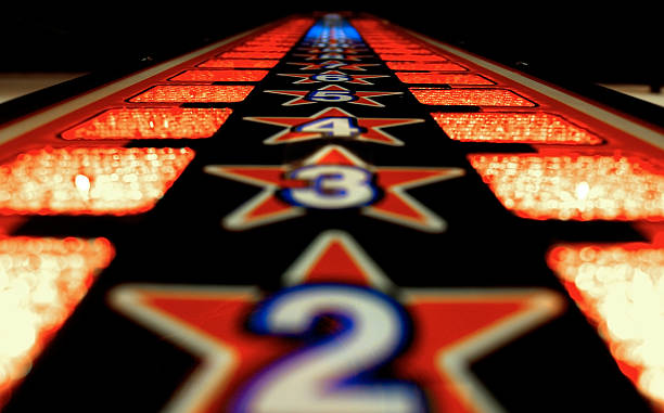 Reach for the stars Test your strength and go for the top. Arcade machine that symbolises that it's a long way to the top. one two three four five six seven eight and nine stock pictures, royalty-free photos & images