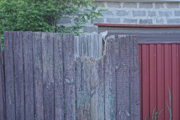 istock gray broken wooden plank old wall fence 1404731021