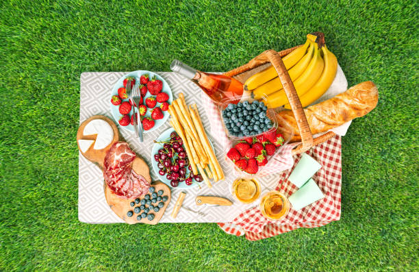 istock Serving a picnic on the table in nature on the lawn. Top view. 1404732135