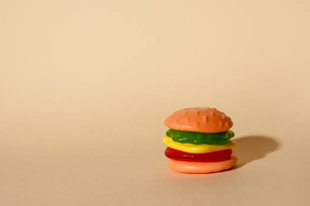 istock hamburger toy on yellow background with copy space 1404732256