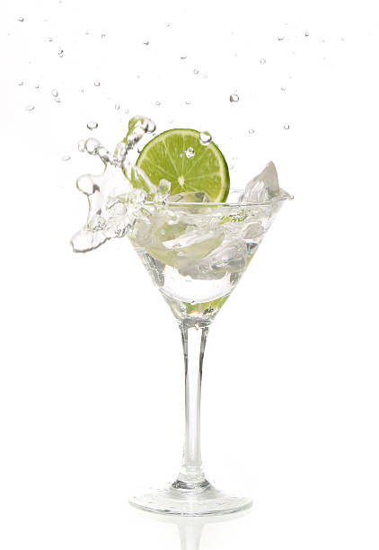 istock Lime splashing into a cocktail glass 140473276