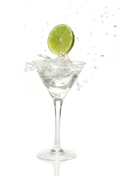 istock Lime splashing into a cocktail glass 140473277