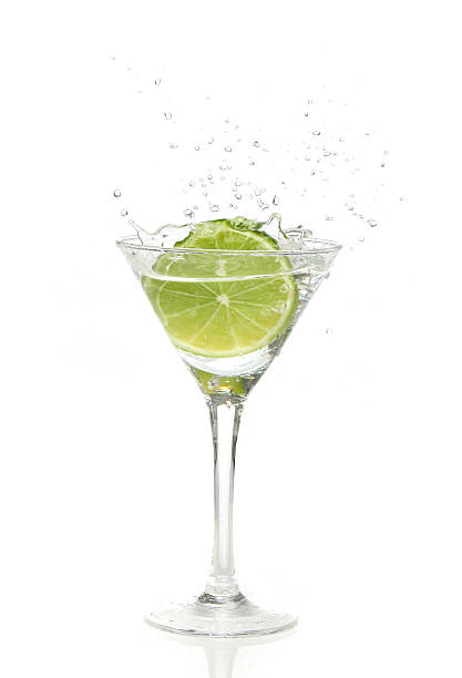 istock Lime splashing into a cocktail glass 140473281