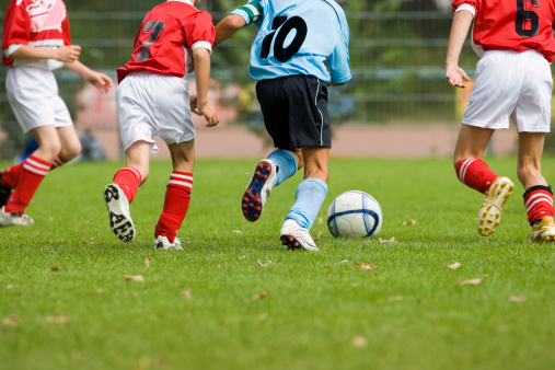 Detail of a soccer game with four players in action 