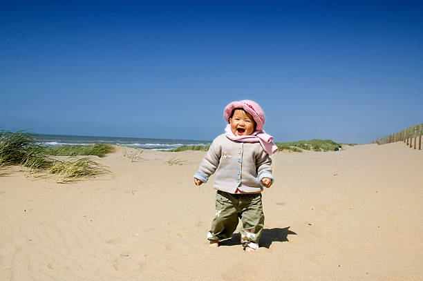 little girl at the beach stock photo