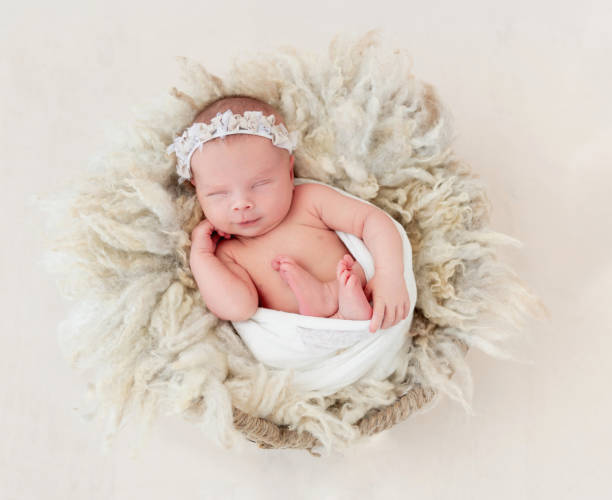 istock newborn baby sleeping in the basket 1404735505