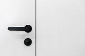 Black handle with lock on entrance door in living room