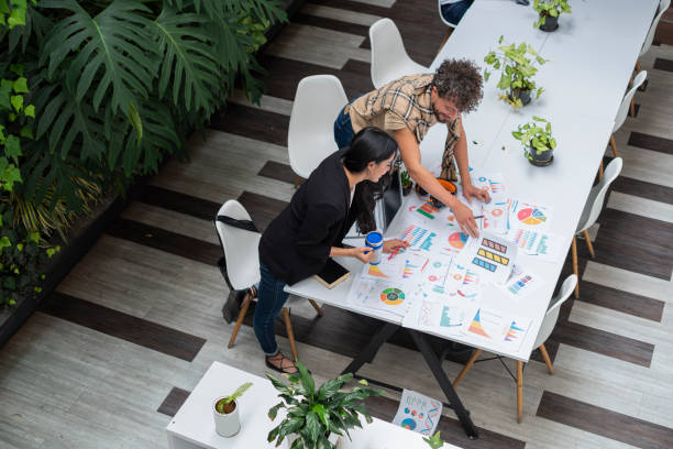 istock Fair-haired gay co-workers are in their office working on a business plan 1404736814