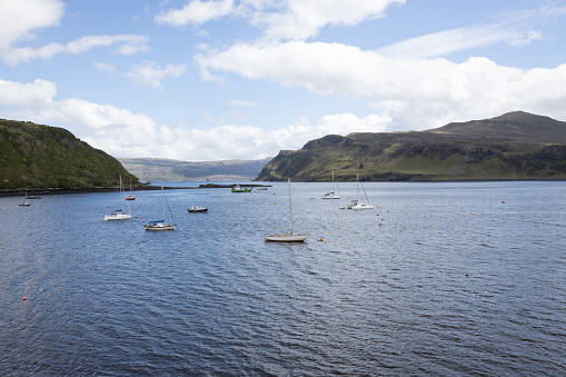 Boats moored in the harbor of the town of Portree on the Isle of Skye in Scotland.