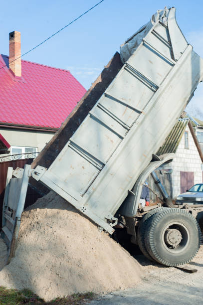 istock Trucks loaded with construction materials- fine grain sand, Transporting building 1404738162