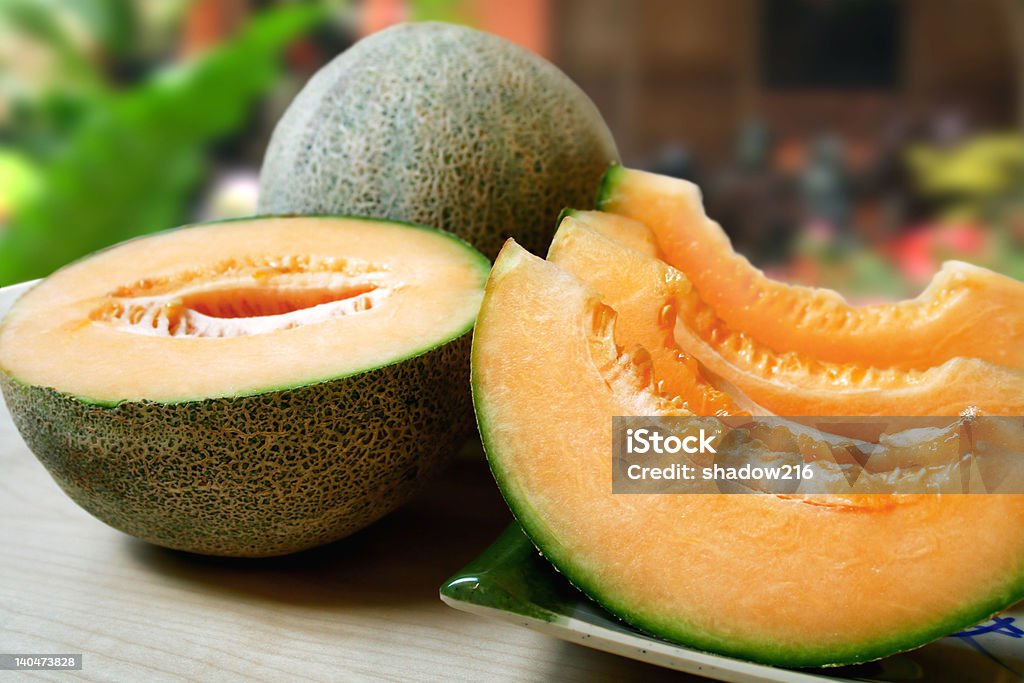 melon sliced fresh cantaloupe at an outdoor setting Cantaloupe Stock Photo