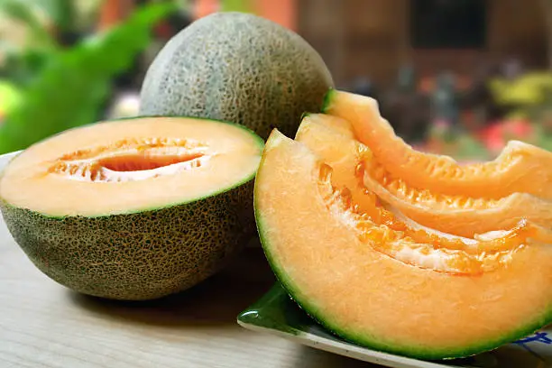 sliced fresh cantaloupe at an outdoor setting