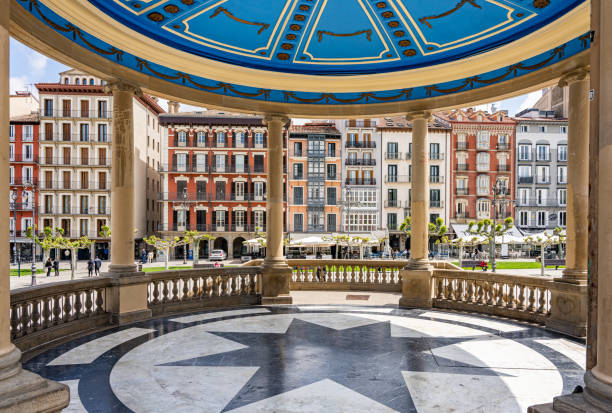 Pamplona, Spain - May 6th 2022 - Tourists passing on the Castillo square (Placa de Castillo) in Pamplona