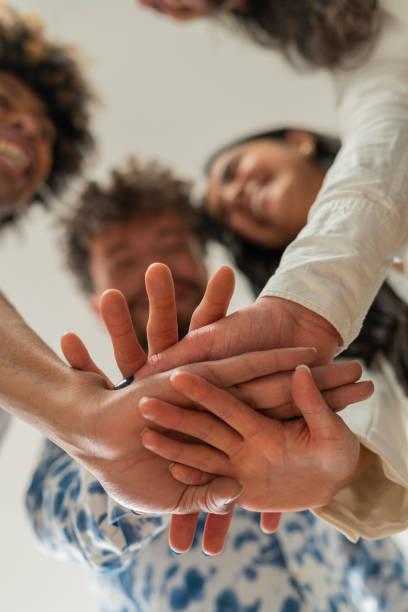 istock The average formally dressed 30 year old gay co-worker stands just joining hands for the photograph 1404740163